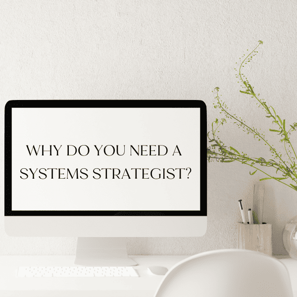 A computer on a desk with the sentence:"Why do you need a systems strategist?"