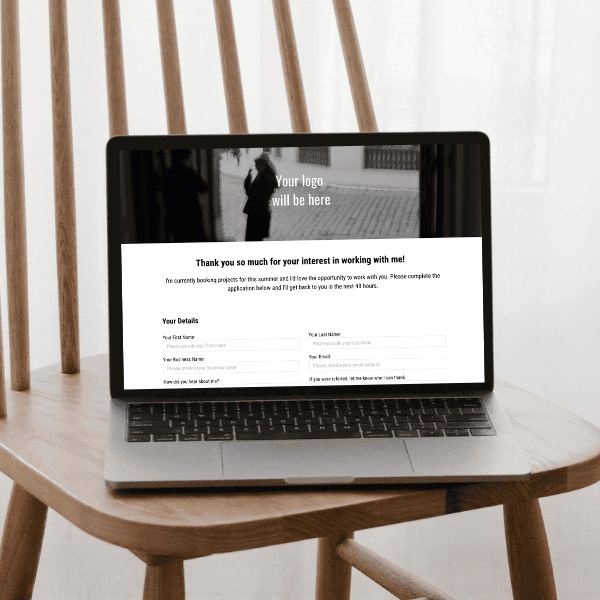 William collection Client Application form on a laptop on a wooden chair.